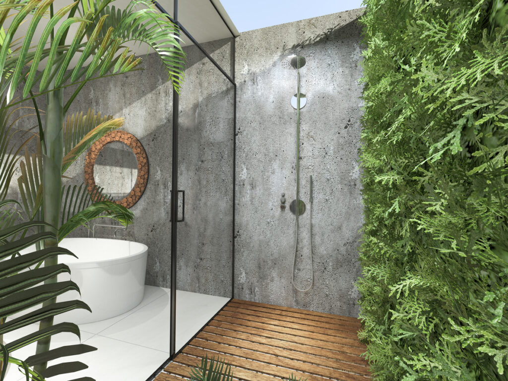 Modern industrial stone wall panelling in a tropical bathroom contrasting with wood and plant organic elements.
