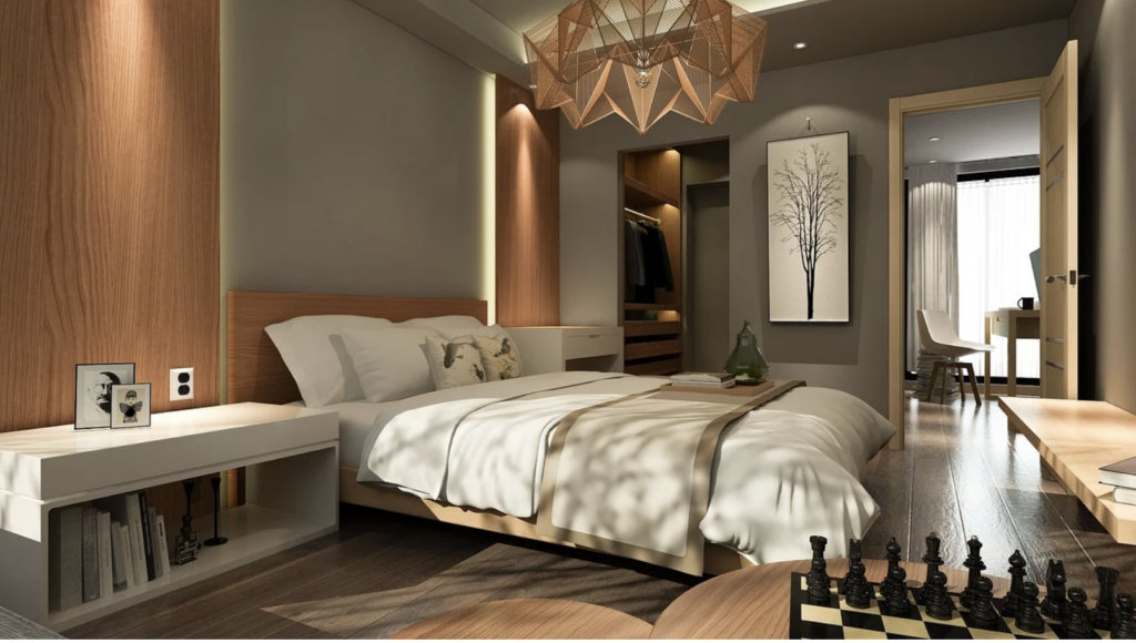 a neutral-coloured bedroom featuring vertical wooden wall panelling on either side of the bed and behind the headboard, a white bedside cabinet with books, and a chess set.