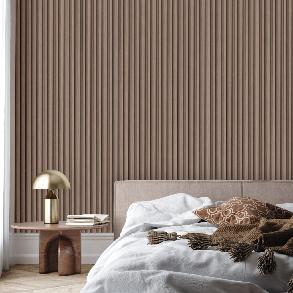 A warm-toned bedroom with a low bed and mahogany wall panels. White and brown bed coverings, a round side table with a brushed gold bedside lamp.