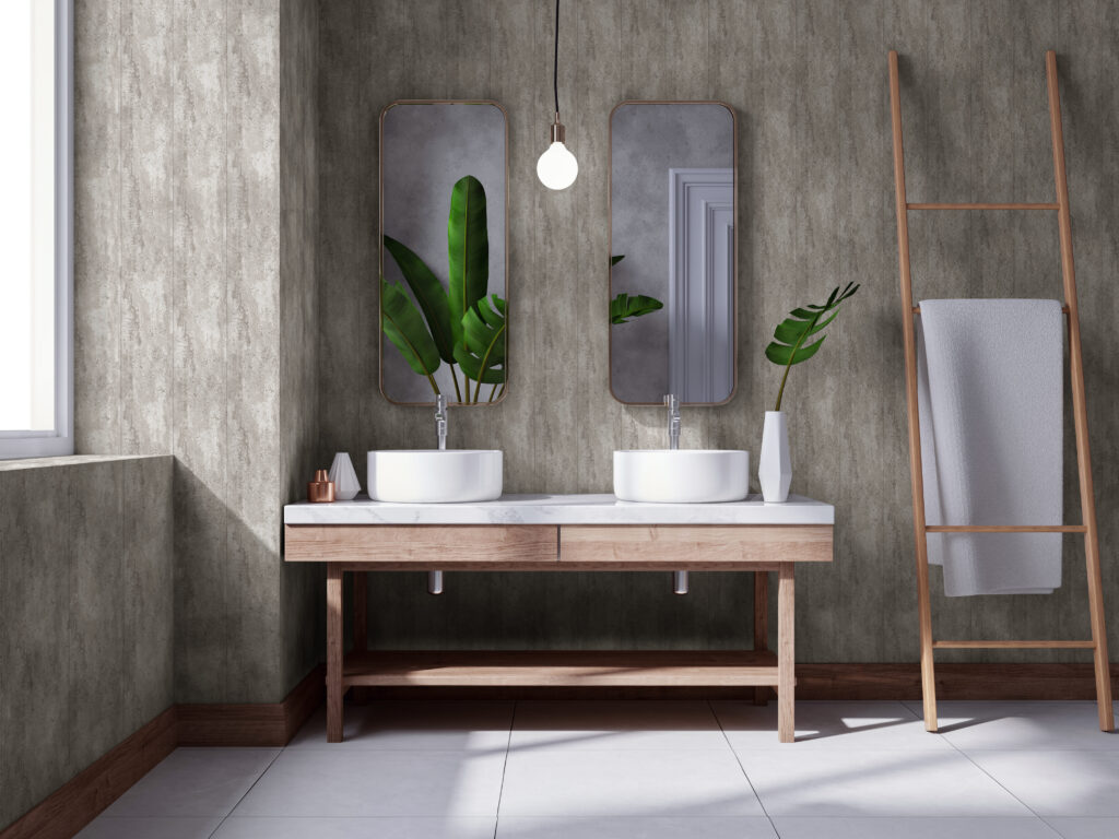 Luxurious bathroom featuring a rustic, textured concrete-effect wall, a light wood double vanity with two basins and matching vertical mirrors.